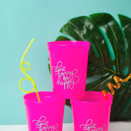 Color Pink Cups with a text don't worry be happy perfect for any Spring parties