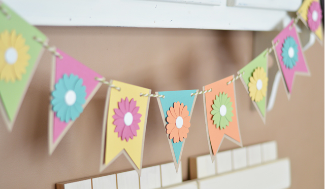 Simple Spring Banner with a variety of shapes and colors and spring flowers added to each shape
