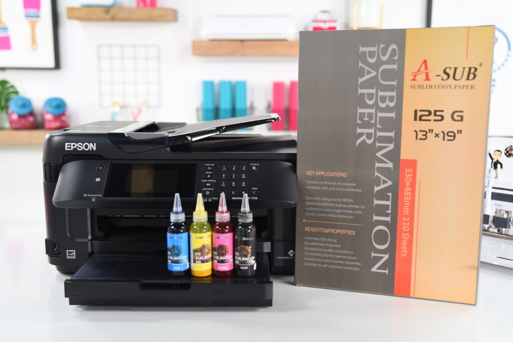 Epson printer, bottles of sublimation ink, sublimation paper