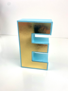 A 3d Letter Made With A Die Cutting Machine