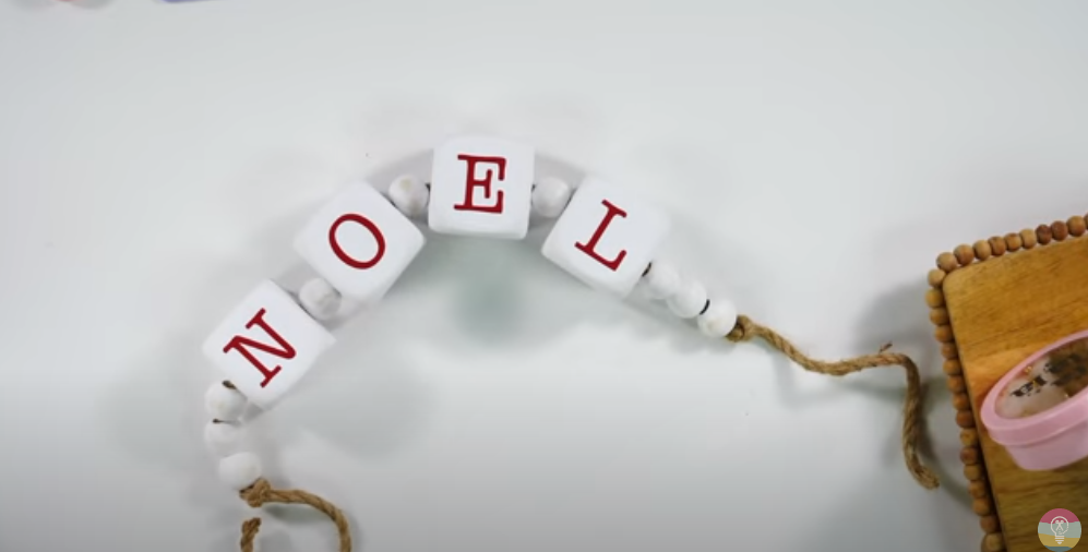 Christmas Garland Of Beads On String Spelling Out Noel